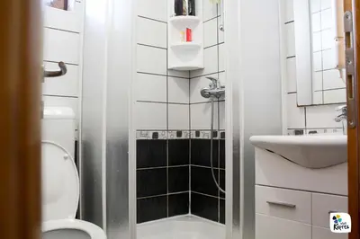 a small bathroom with a toilet and a sink at Adria in Kupres