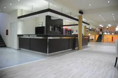 a large room with a counter in a building at Motel OAZA in Cazin