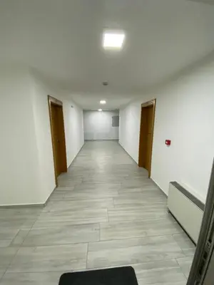 an empty hallway in an office building at Motel OAZA in Cazin