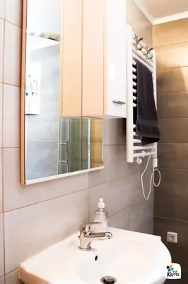 a bathroom with a sink and a mirror at Apartman Adria 2 in Kupres