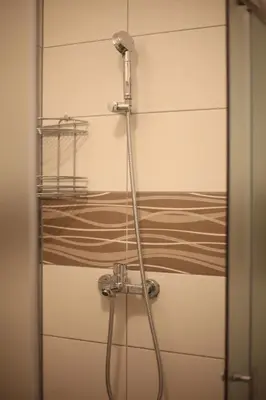 a shower in a bathroom with a glass door at Apartment Perviz in Bihać