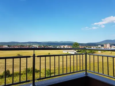 a view of a field from a balcony at Apartment Perviz in Bihać