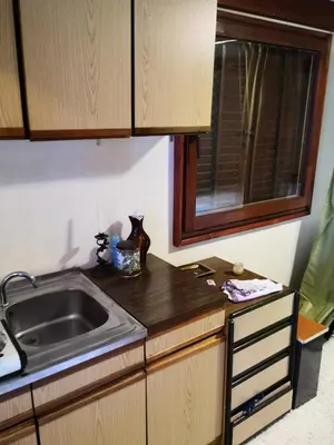 a kitchen with a sink and a counter top at Holiday Home Dragon in Visoko