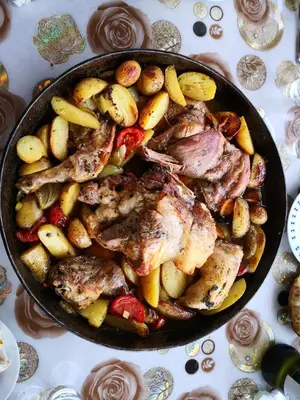 a pan filled with meat and vegetables on a table at Holiday Home Dragon in Visoko