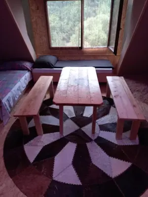 two wooden tables in a room with a couch at Pyramid in Visoko