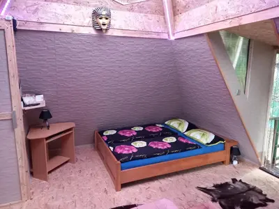 a bedroom with a bed with a lion head on the wall at Pyramid in Visoko
