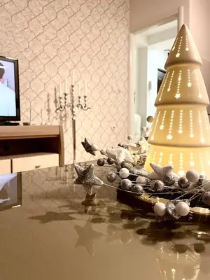 a christmas tree sitting on top of a table at Apartman CITY CENTER 1-šetalište in Prijedor