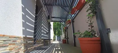 an alley with potted plants on the side of a building at Apartments Jack in Bihać