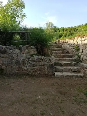 an old stone wall with a bunch of stairs at BUNGALOV COZY UNA in Kulen Vakuf