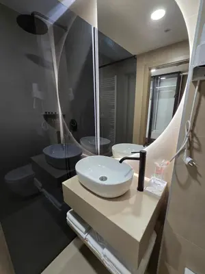 a bathroom with two sinks and a mirror at Hotel IN in Žepče