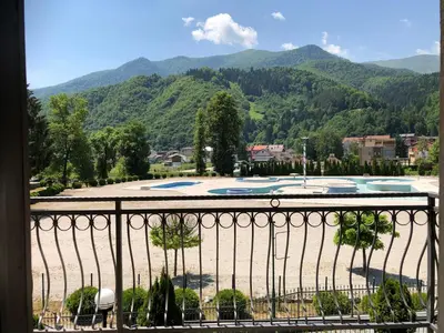 a view of a swimming pool from a balcony at Apartment Nice View in Fojnica