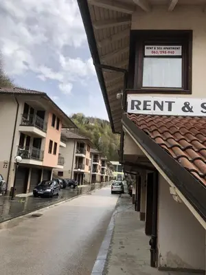 an empty street with a sign on a building at Apartment Nice View in Fojnica