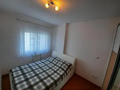 a small bedroom with a bed and a window at CENTAR 2 BANJA LUKA in Banja Luka