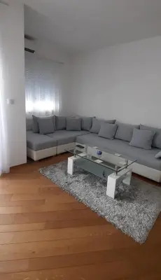 a living room with a couch and a coffee table at CENTAR 2 BANJA LUKA in Banja Luka