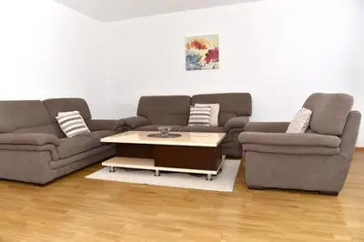 a living room with two couches and a coffee table at Sutjeska in Modriča