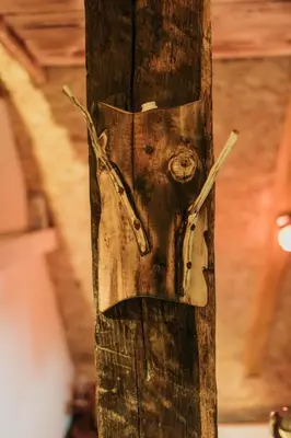 a wooden pole with a face on it at Etno Village Dolina Sreće in Vitez