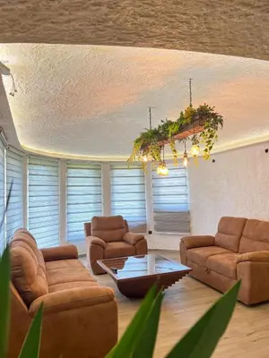 a living room with couches and a coffee table at Motel pizzeria Actros in Nova Topola