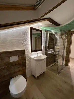 a bathroom with a toilet and a sink and a shower at Motel pizzeria Actros in Nova Topola