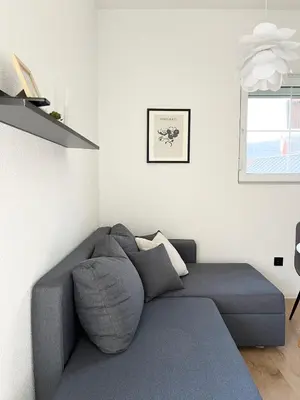 a living room with a gray couch in a room at Home Away From Home in Jajce