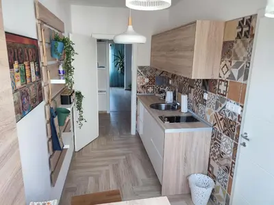 a kitchen with a sink and a counter top at Apartman Lena in Tuzla
