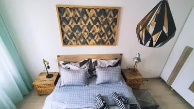 a bedroom with two beds and two night stands at Apartman Lena in Tuzla
