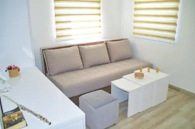 a living room with a couch and a table at Apartman “Centar Jajce “ in Jajce