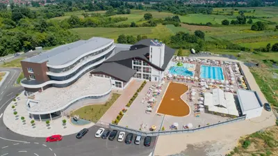 an aerial view of a large building with a pool at Hotel Terme Ozren in Bosansko Petrovo Selo
