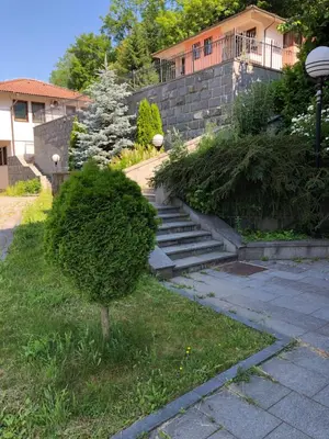 a set of stairs in front of a house at Street View Apartman in Fojnica