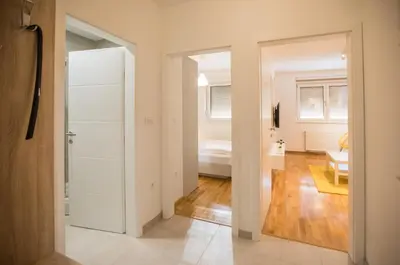 a room with a door leading to a bedroom at Jelena Apartment II in Doboj