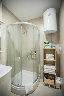 a bathroom with a shower with a glass shower stall at Jelena Apartment II in Doboj