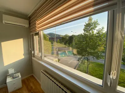 a window in a room with a view of a street at Apartman 