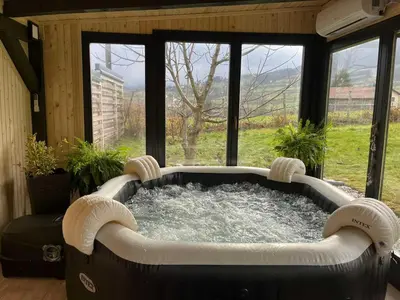 a large hot tub in a room with a window at Residence Wood Pool & SPA in Visoko