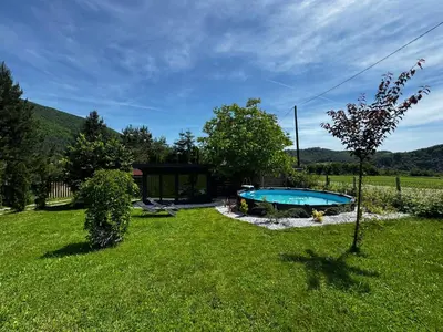 a yard with a swimming pool and a house at Residence Wood Pool & SPA in Visoko