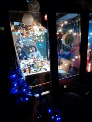 a christmas kitchen with a christmas tree and lights at Pyramid in Visoko