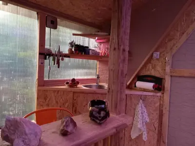 a kitchen with a counter and a sink and a table at Pyramid in Visoko