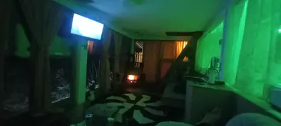 a dark room with a green light on the wall at Pyramid in Visoko