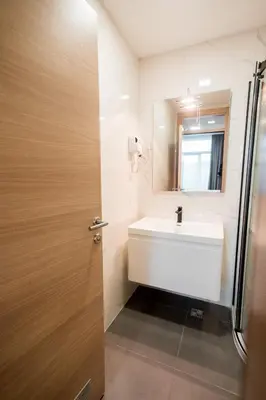 a bathroom with a sink and a mirror at Hotel IN in Banja Luka
