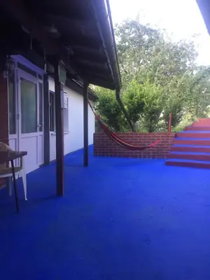 a group of blue carpeted stairs in a building at Dolores in Tešanj