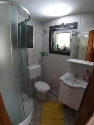 a bathroom with a toilet and a sink and a shower at COUNTRY HOUSE in Bihać