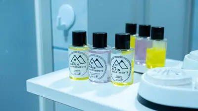 three bottles of essential oils sitting on a counter at Alpin Apartments Vlašić in Vlasic