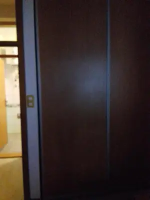 a black door in a room with a mirror at City View Apartment in Fojnica
