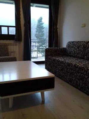 a living room with a coffee table and a couch at City View Apartment in Fojnica