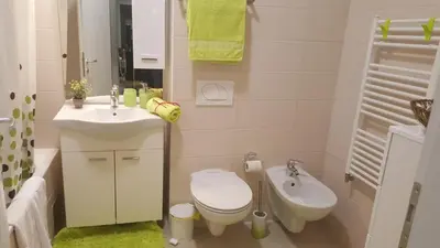 a small bathroom with a toilet and a sink at Fantasy apartment Tuzla in Tuzla