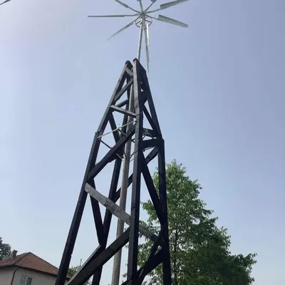 a windmill sitting on top of a pole at Apartman Bosanska Avlija-Muzej- in Visoko