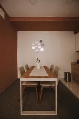 a dining room with a table and chairs at ATOS Centar in Čelinac