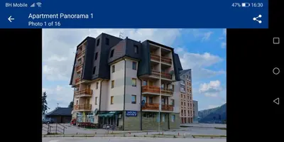 a building with a black roof on top of it at Apartman SARA Babanovac Vlašić in Travnik