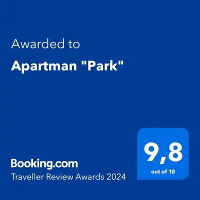 a blue sign that sayspared toanuariari park at Apartman 
