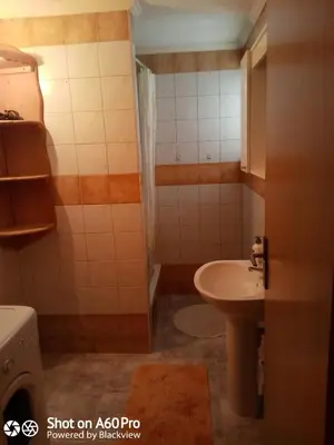 a small bathroom with a sink and a toilet at kuća za odmor Katy in Kupres