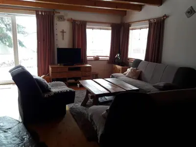 a living room with a couch and a coffee table at kuća za odmor Katy in Kupres