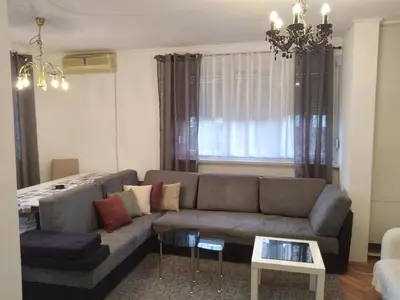 a living room with a couch and a table at Apartman CENTAR in Banja Luka